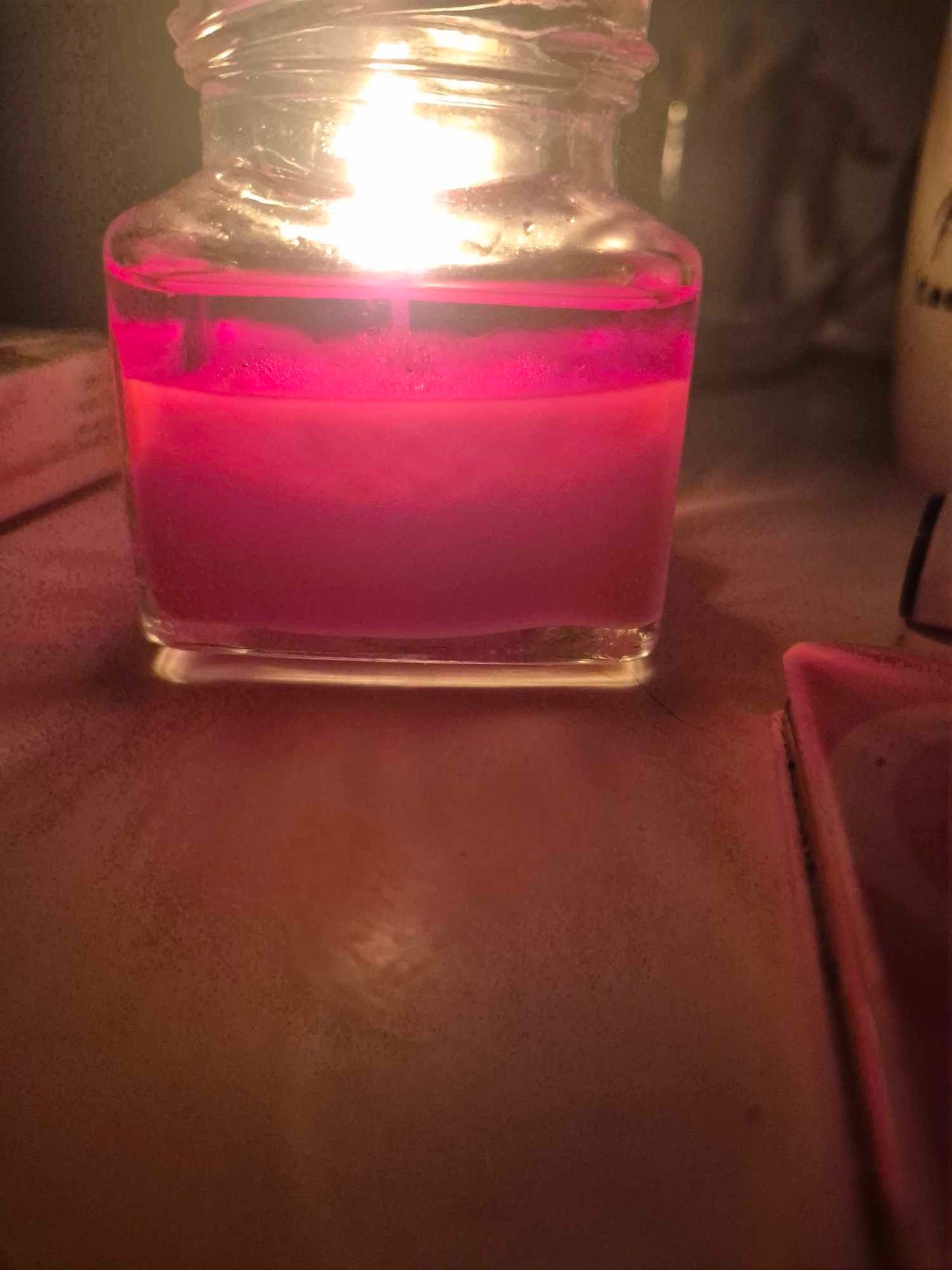 Rose candle in glass jar