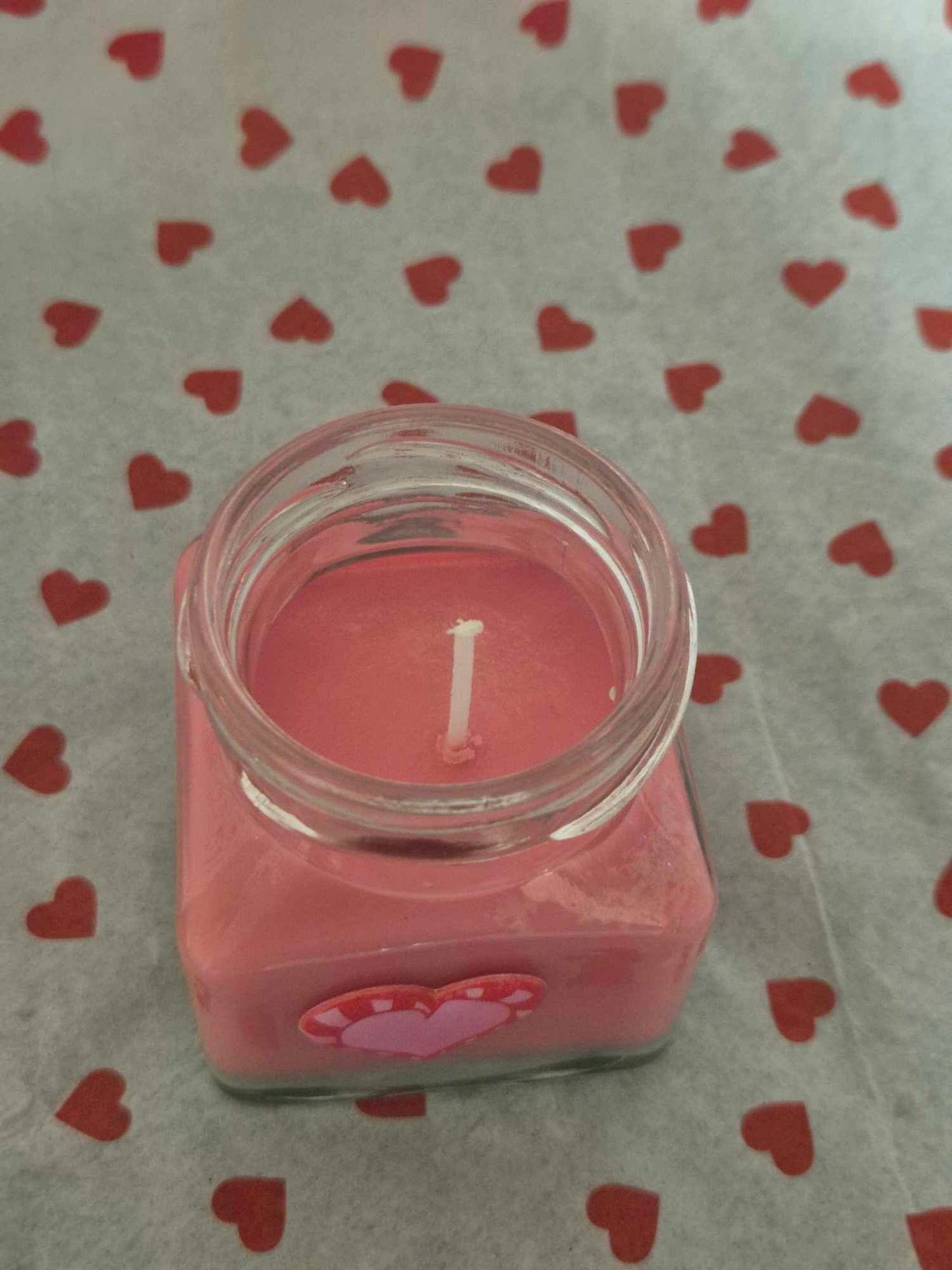 Rose candle in glass jar