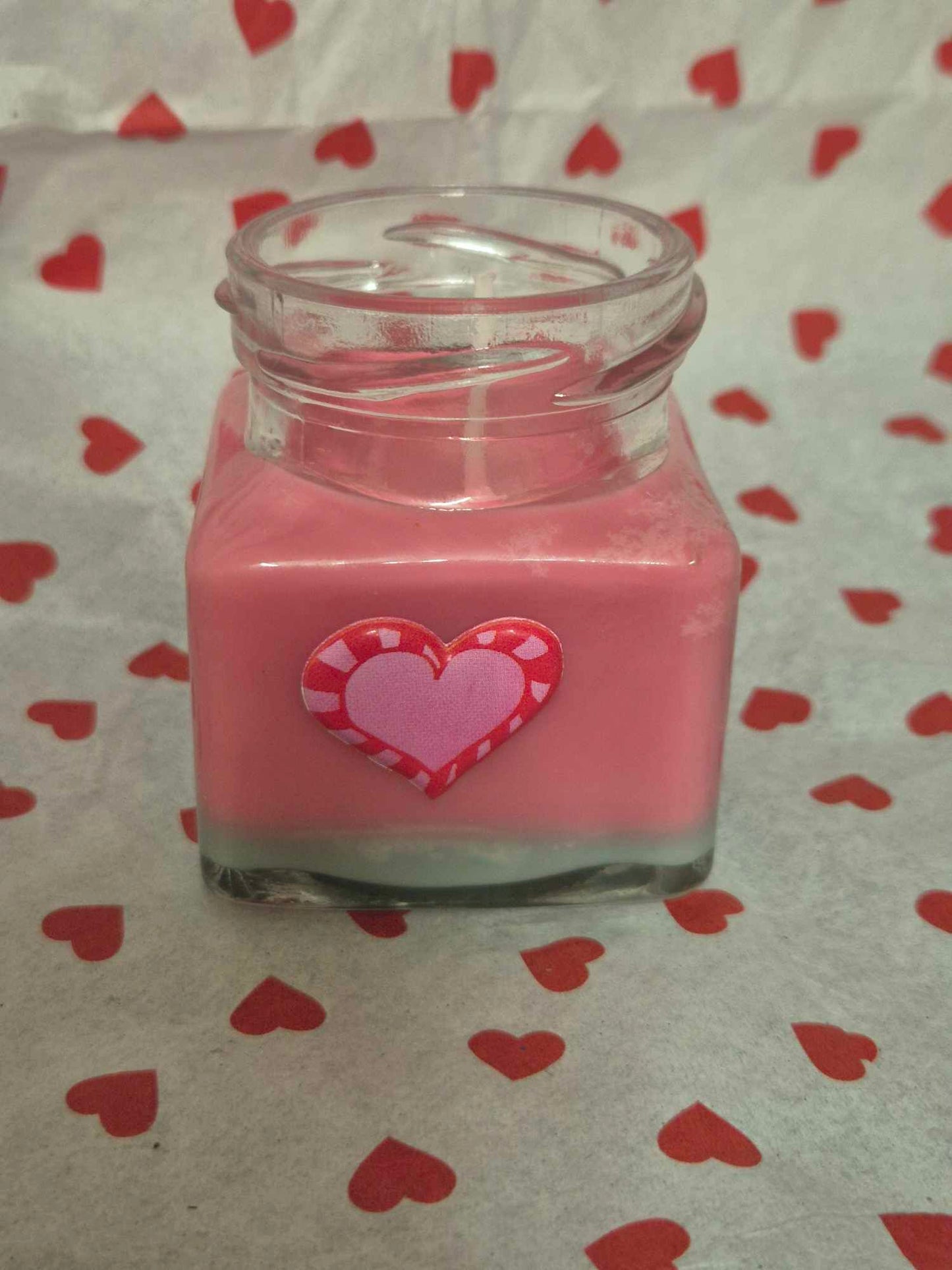 Rose candle in glass jar