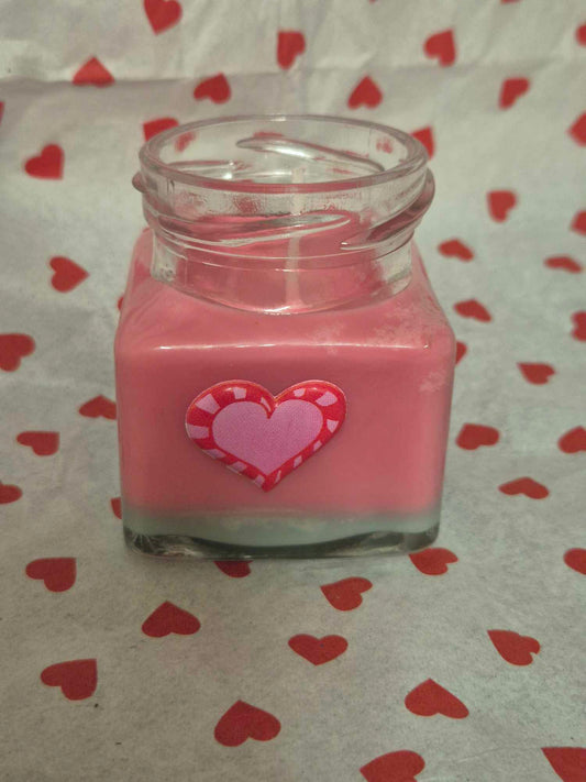 Rose candle in glass jar